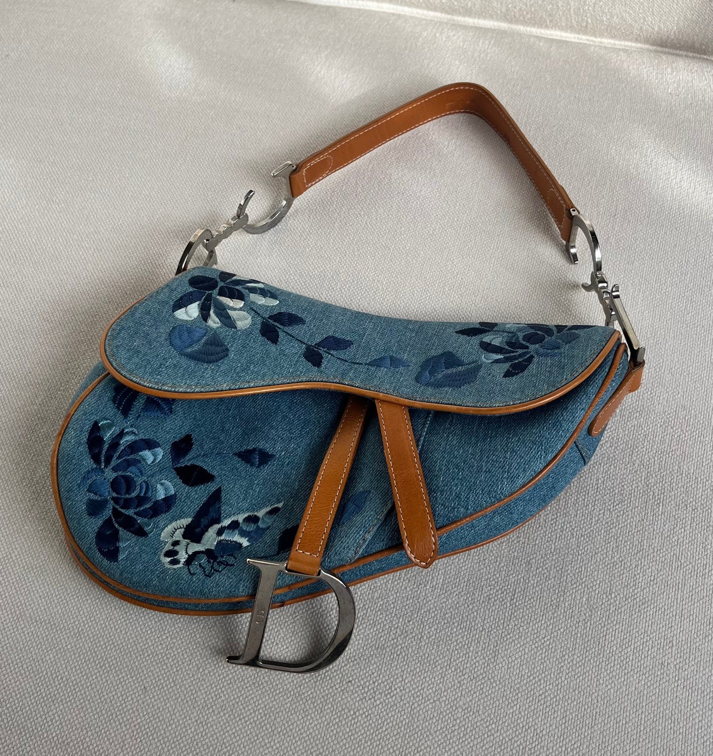 Dior Denim Embroidered Butterfly Saddle Bag with cognac brown leather