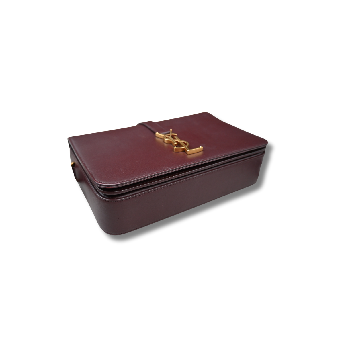 A burgundy Saint Laurent satchel crossbody bag with a gold-finish logo, displayed against a white background