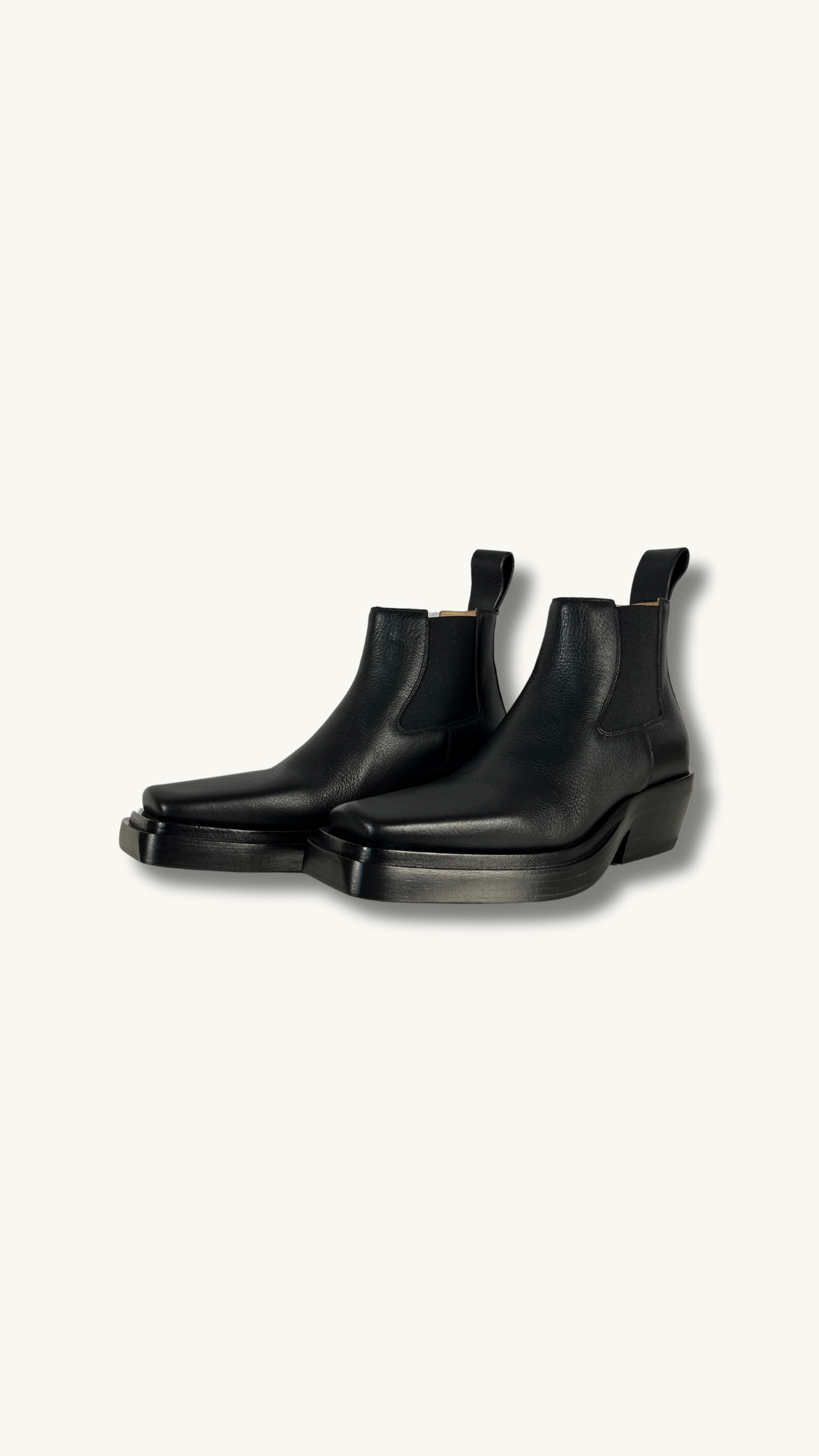 Bottega Veneta Lean Chelsea Boot with square toes and leather pull-loop at heel collars.