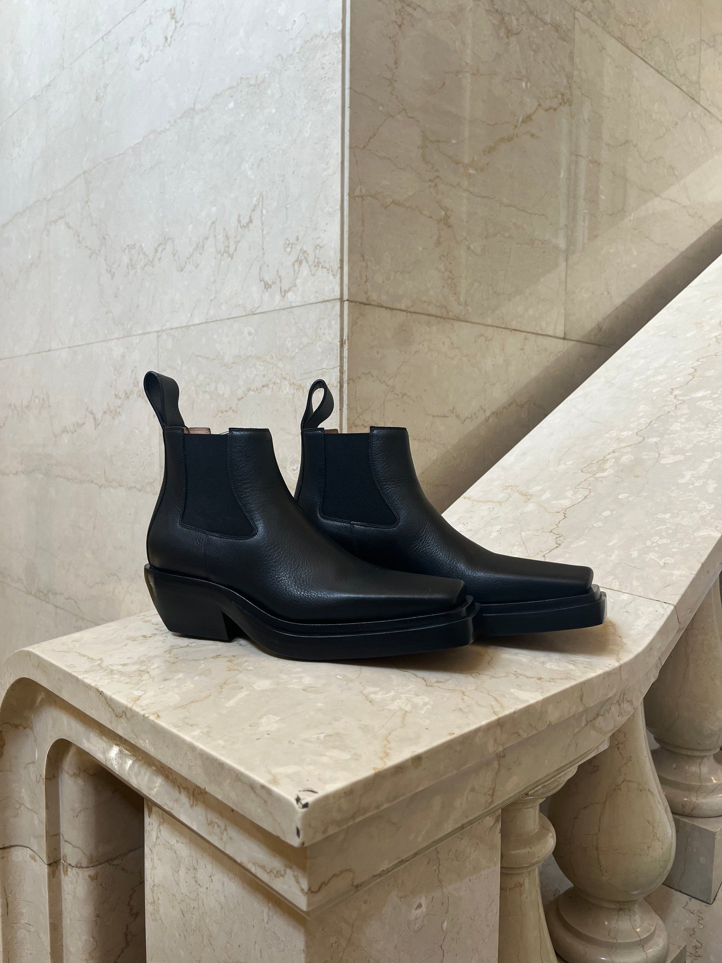 Bottega Veneta Lean Chelsea Boot with square toes and leather pull-loop at heel collars.