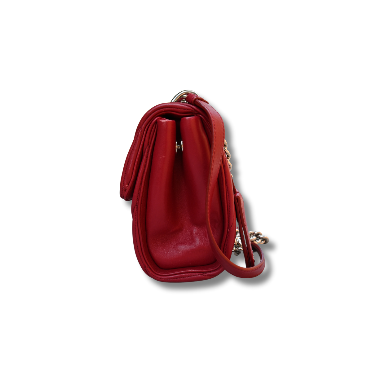 A red Miu Miu matelassé nappa leather shoulder bag with a textured finish, featuring a logo on the front and a chain strap.